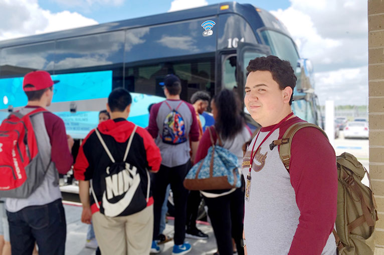 School Charters Kids Loading On Blue Luxury Bus Smiling Wearing School Shirts